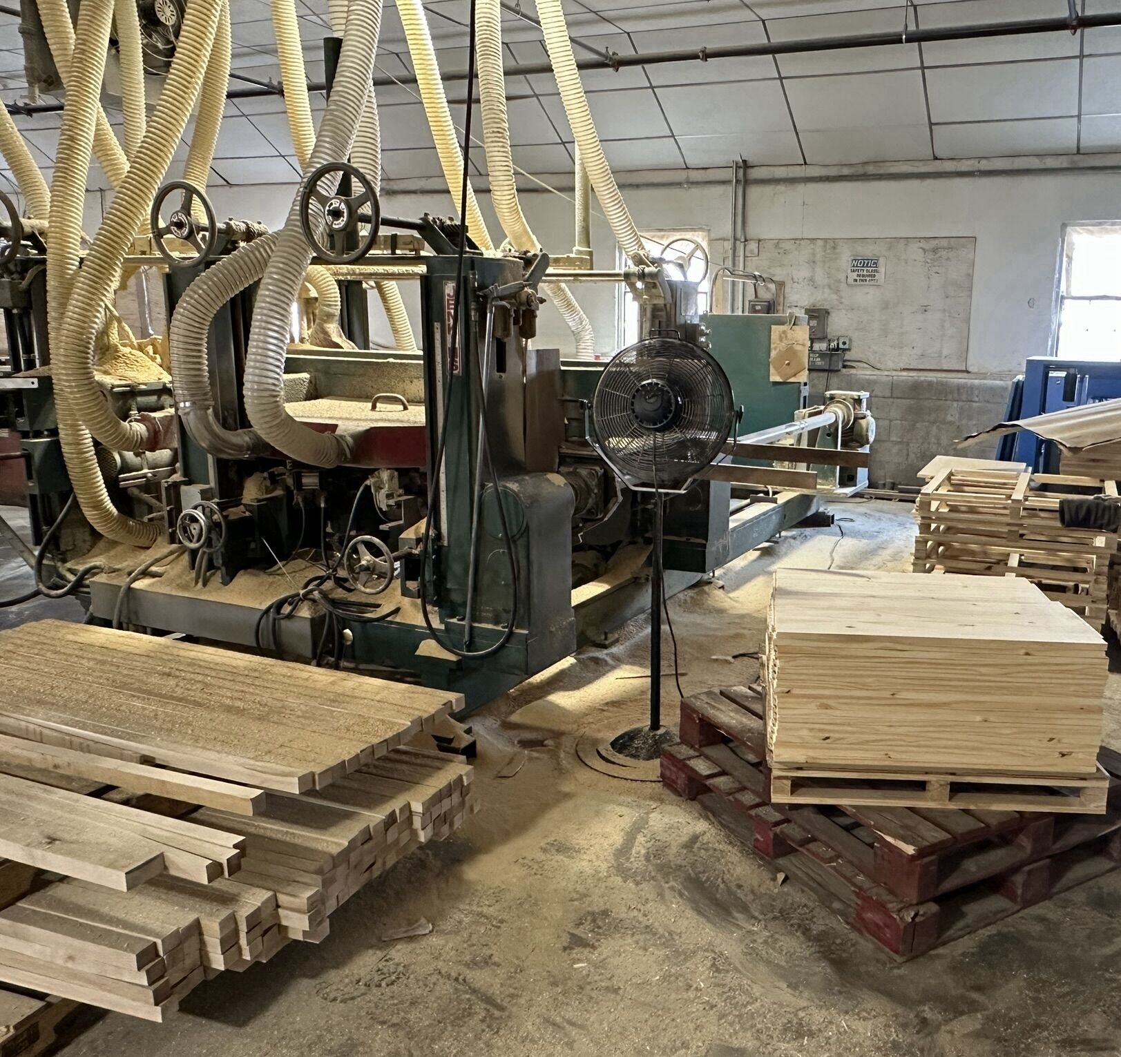 Solid wood Lundia shelves moving through production